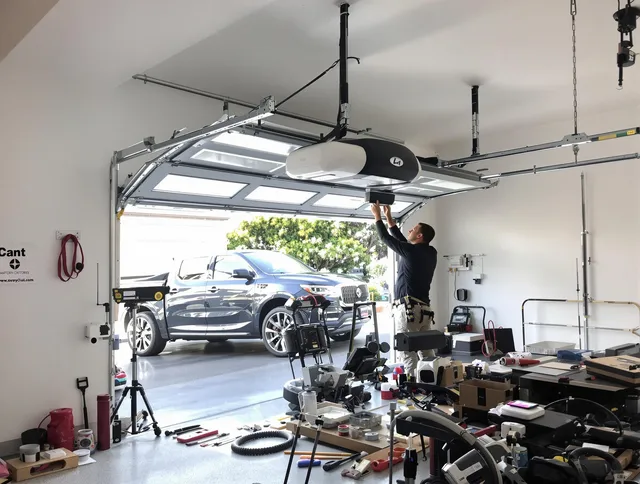 Hopkinton Garage Door Repair specialist installing smart garage door opener system in Hopkinton home